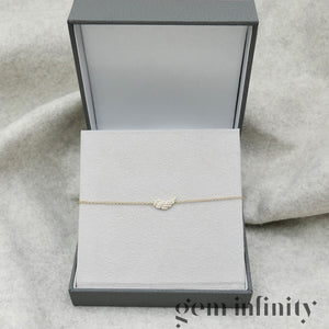 Gold and diamond angel wing bracelet