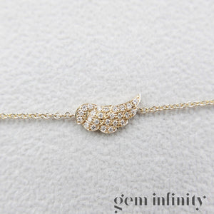 Gold and diamond angel wing bracelet