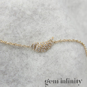 Gold and diamond angel wing bracelet