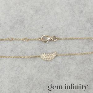 Gold and diamond angel wing bracelet