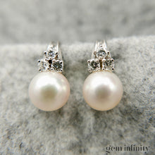 Upload image to gallery, Pair of white gold, pearl and diamond ear clips
