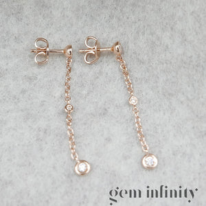 Pink gold and diamond pendant earrings