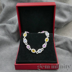 White gold bracelet, colored sapphires and diamonds